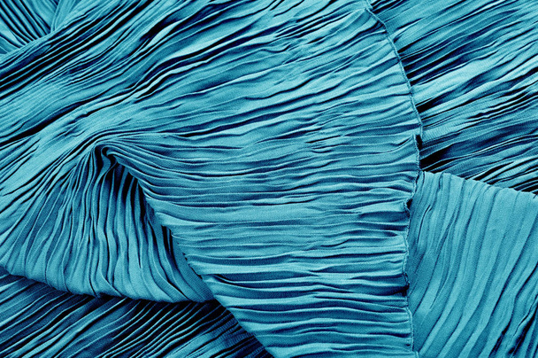 Textura, fondo, patrón, paño plisado azul. Un acabado brillante
 - Foto, Imagen