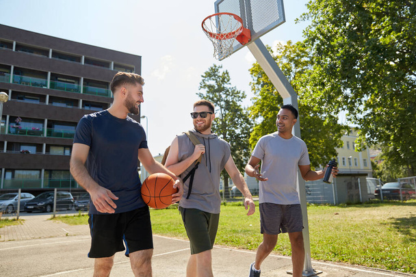 group of male friends going to play basketball - Foto, Imagem