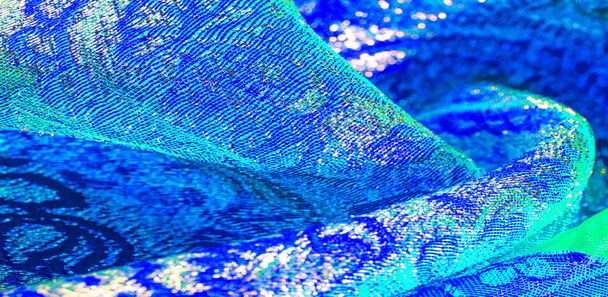 Текстура фона, рисунок. ткани из синей парчи. Органза парчовая
 - Фото, изображение