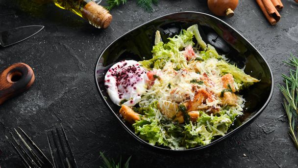 Vegetable salad with chicken fillet and poached egg. Caesar salad. Top view. Free copy space. - 写真・画像