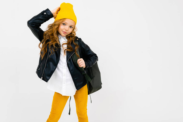 cute fashionable little girl in leather jacket with backpack - Foto, Imagen