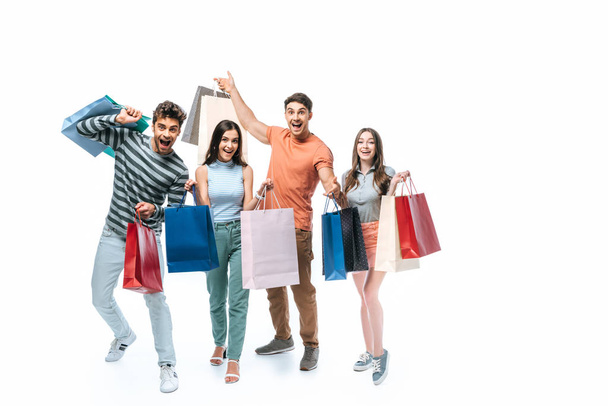 emotional friends with shopping bags together, isolated on white - Φωτογραφία, εικόνα