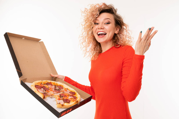 young woman in red dress posing with pizza against white background   - Foto, Imagem