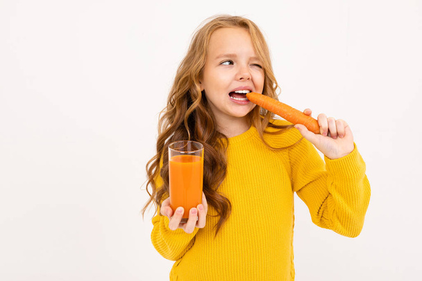 cute girl posing with juice in studio on light background  - Photo, Image