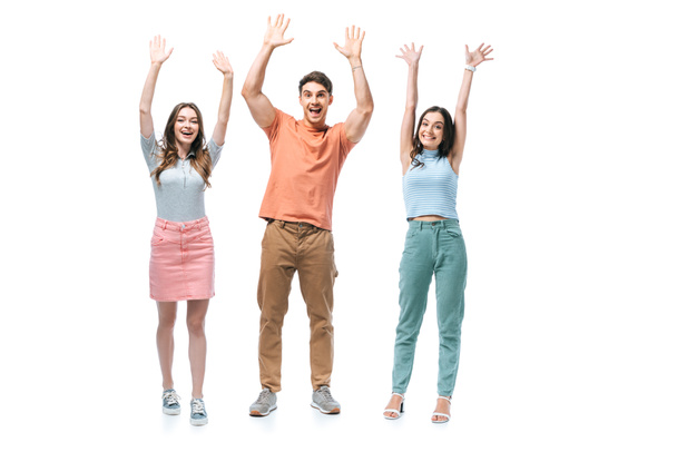 positive friends standing together with hands up, isolated on white - Valokuva, kuva