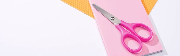 panoramic shot of scissors, notebook and paper on white background  - Photo, Image