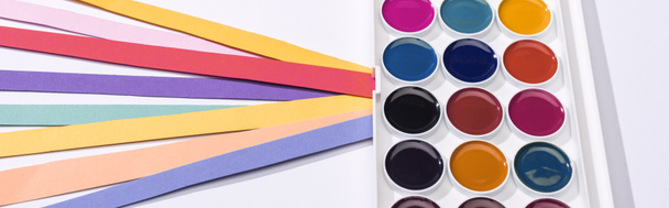 panoramic shot of watercolor and bright paper strips on white background  - Photo, Image