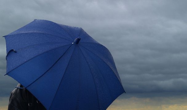 Blue wet umbrella for keeping you dry - Zdjęcie, obraz