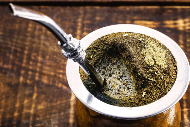 A typical Brazilian drink, o chimarrão, or mate, is a characteristic drink of Southern South American culture. It is one of the symbols of the Rio Grande do Sul tradition. - Photo, Image