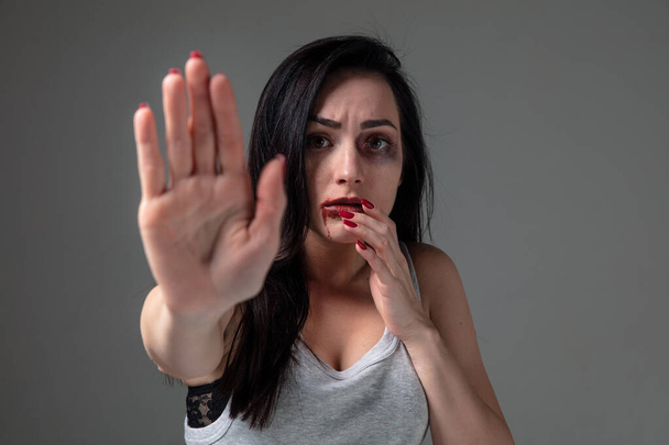 Woman in fear of domestic abuse and violence, concept of female rights - Фото, изображение
