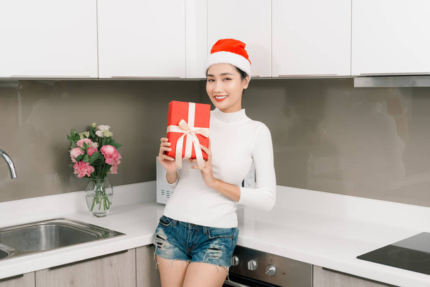 Happy young woman with christmas gifts  - Photo, Image
