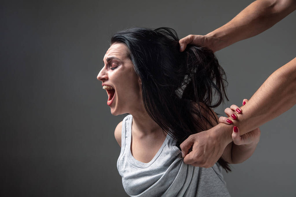 Woman being under domestic abuse and violence, concept of female rights - Φωτογραφία, εικόνα