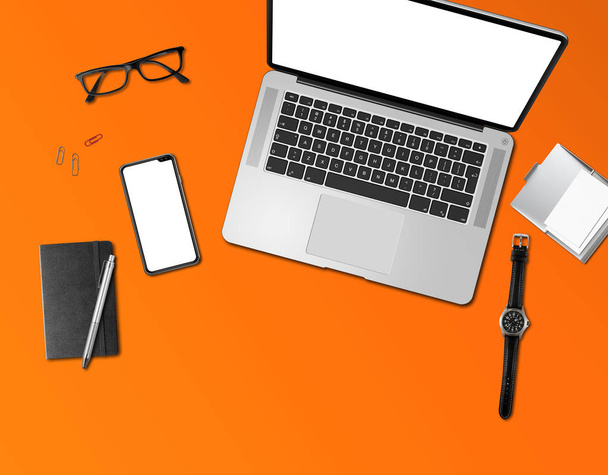 Office desk mockup top view isolated on orange - Photo, image