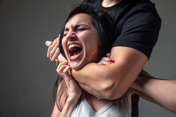 Woman being under domestic abuse and violence, concept of female rights - Foto, Bild