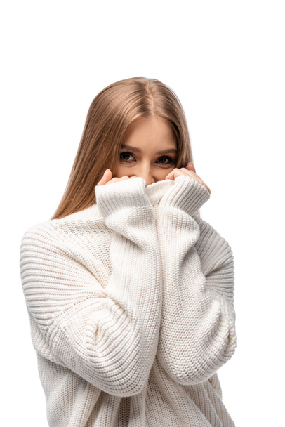 attractive cold young woman in white sweater, isolated on white - Foto, Imagem