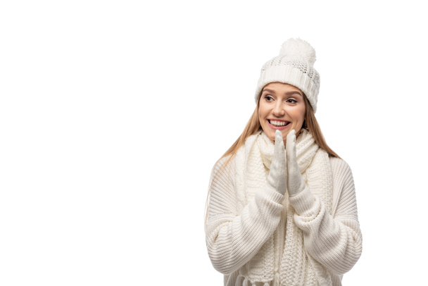 beautiful excited girl clapping hands in white knitted clothes, isolated on white - Fotó, kép