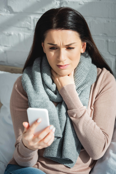 sick woman having online consultation with doctor on smartphone - Foto, Imagem