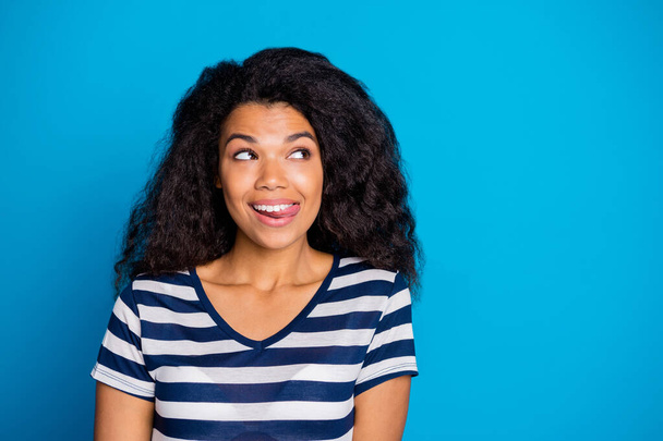 Close up photo of inspired cheerful positive afro american girl feel hungry dream think about tasty delicious yummy food ice-cream wear good looking outfit isolated over blue color background - Zdjęcie, obraz