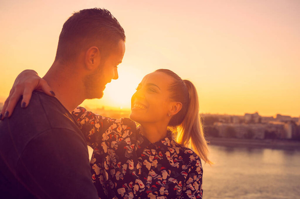 Young woman enjoying in  love at sunset - Photo, Image