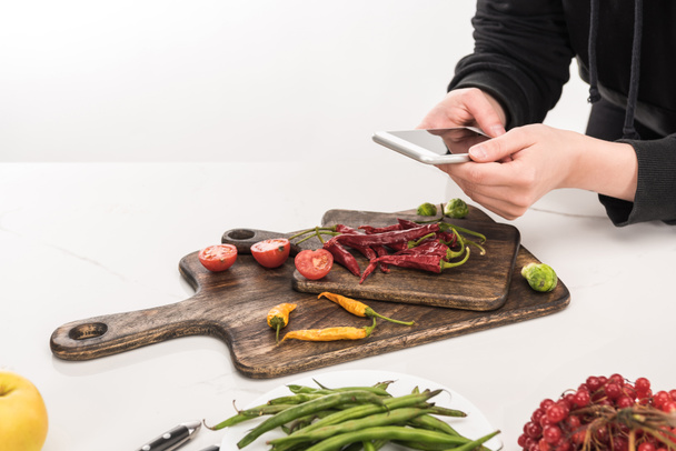 cropped view of professional photographer making food composition for commercial photography on smartphone - Photo, Image