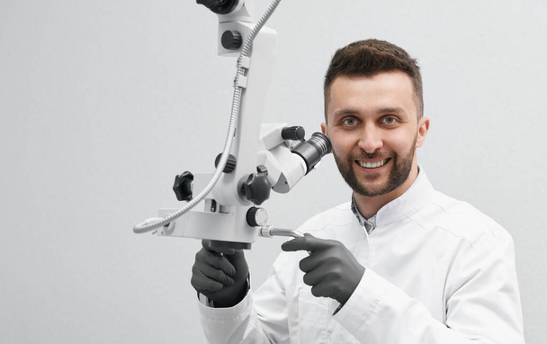 Front view of professional dentist on isolated background - Fotó, kép