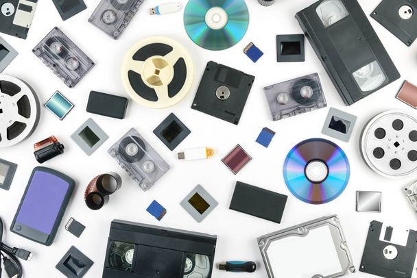 Retro technology and new media on a white background. Flat lay - 写真・画像