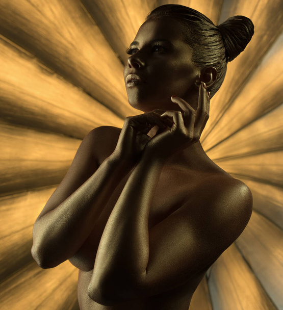 Naked model with golden trendy makeup and bodyart - Photo, image