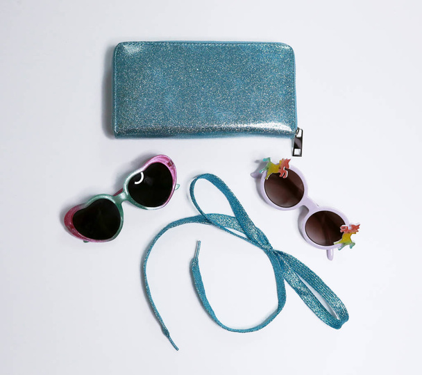 set of fashion accessories - shiny clutch, bow of lace, sunglasses - Fotoğraf, Görsel