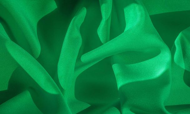 Υφή, μετάξι ύφασμα από πράσινο χρώμα, στερεό ανοιχτό πράσινο μετάξι sati - Φωτογραφία, εικόνα