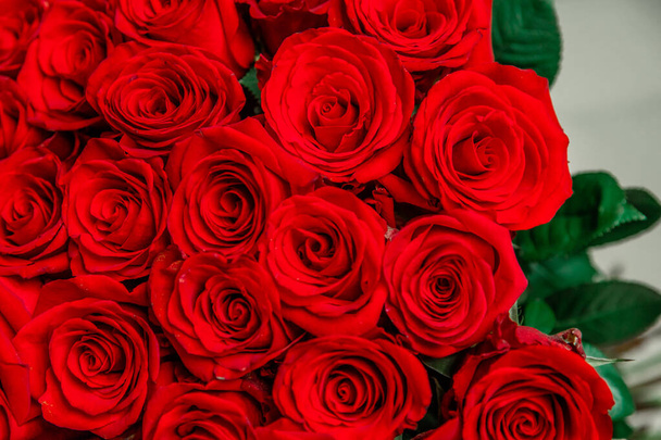 Cropped top-view photo of bouquet of big tender red roses. - Photo, Image