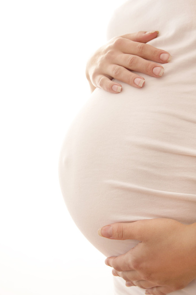 die Schwangere auf weißem Hintergrund - Foto, Bild