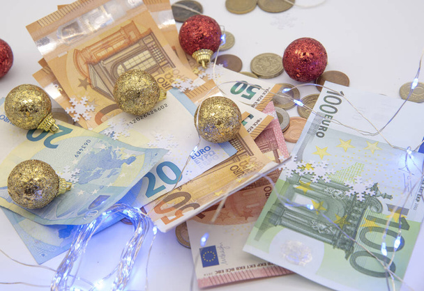 Euro bills and different coins with Christmas decoration  - Foto, Bild