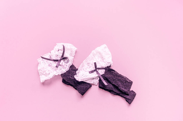 Stockings black female mesh. Pink background. Flat lay - Photo, Image