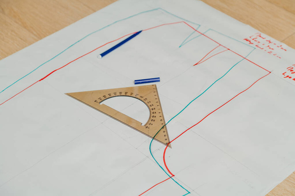 Transparent ruler is on  paper pattern. - Фото, изображение