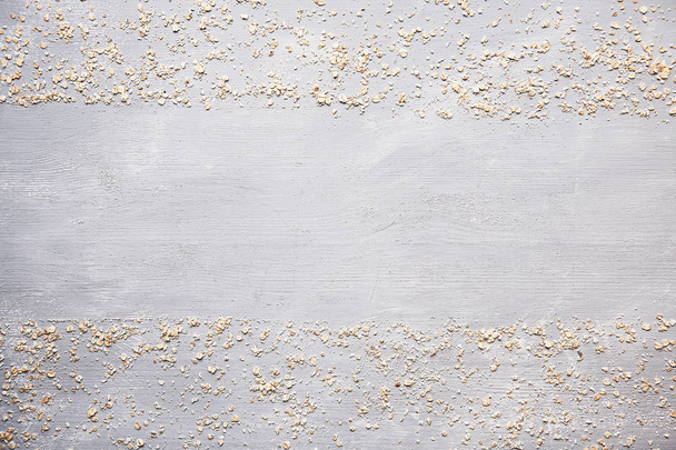 Flakes on a gray background top view frame - Valokuva, kuva
