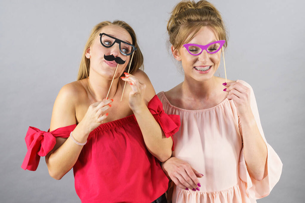 Women with party decoration mask stick glasses - Foto, Imagem