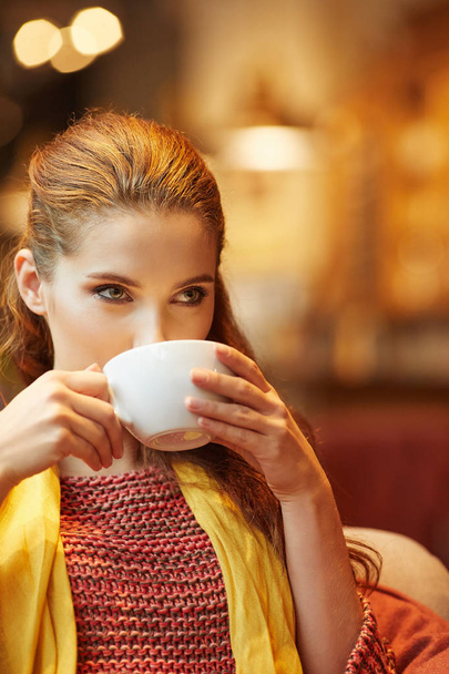 Portrait of beautiful woman drinking coffee at cafe  - Zdjęcie, obraz