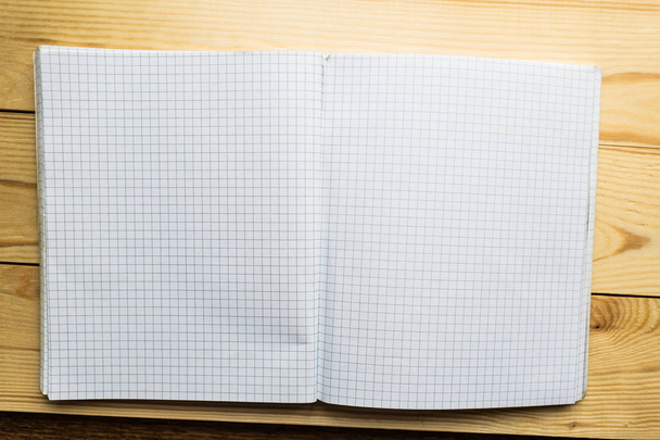 Open notebook on wooden background - Foto, imagen