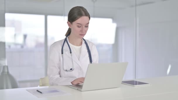 Ambitious Young Female Doctor Working on Laptop in Office - Video