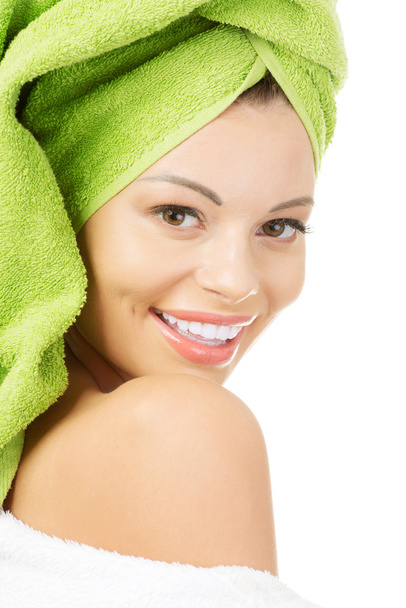 Beautiful woman with a towel on her head - Fotó, kép