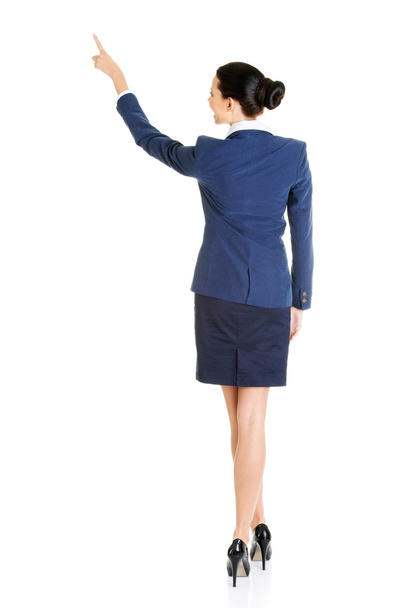 Business woman pointing on copy space - Фото, изображение