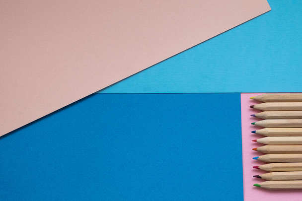 closeup blue and pink pencil on blue and pink colors background. minimal concept - 写真・画像