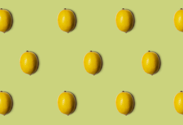 Lemons pattern isolated on green background. Fresh food. Nature. - Fotó, kép