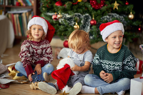 child boy in Santa hat at Christmas.Happy  childhood on  Christm - Foto, Bild