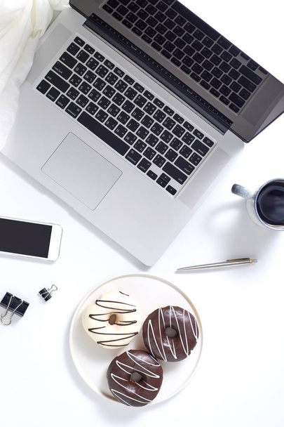Office desktop with laptop and accessories, top vie - Foto, Imagen