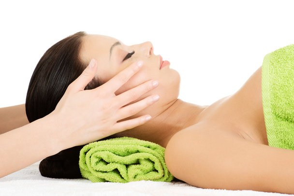 Beautiful relaxed woman enjoy receiving face massage - Foto, Bild