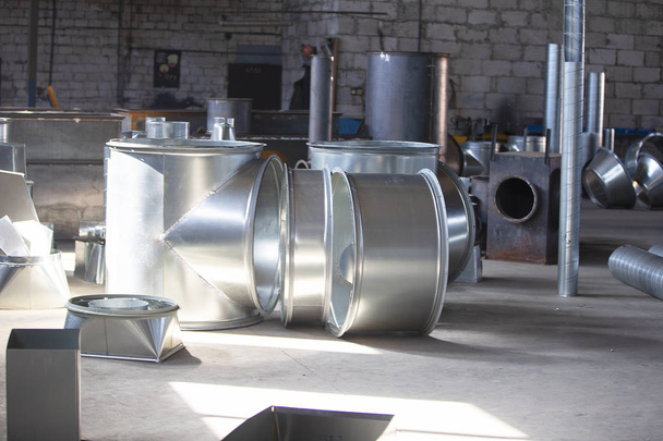 Workshop in the factory for the manufacture of ventilation pipes. Ventilation metal pipes. - Photo, Image