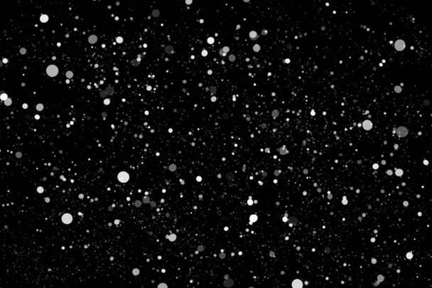 Witte sneeuw op een zwarte achtergrond textuur. - Foto, afbeelding