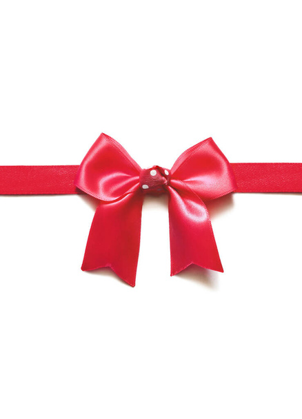 Red ribbon with bow on white. Holiday concept. - Photo, Image