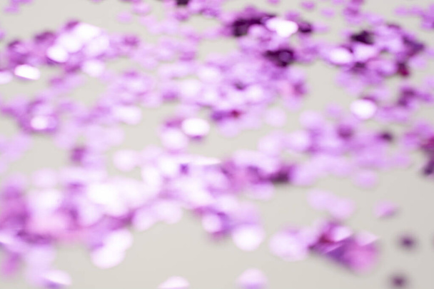 Pink glitter background unfocused. Abstract heart shaped purple sparkling glitter. Christmas, holidays. - 写真・画像